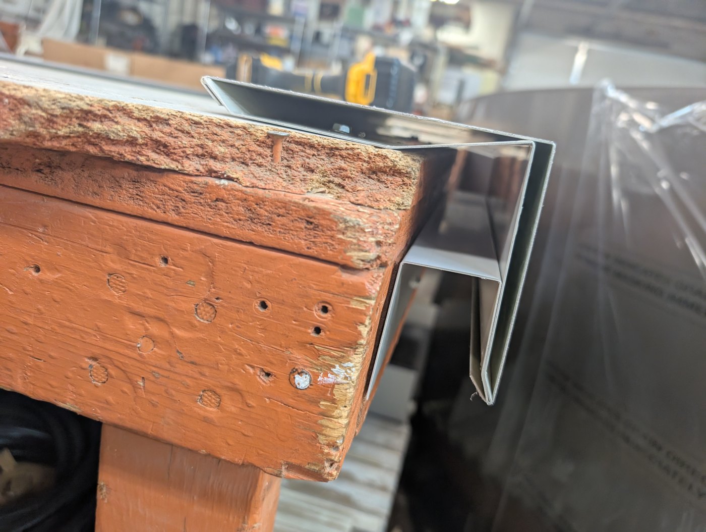 Custom drip edge flashing on brick parapet